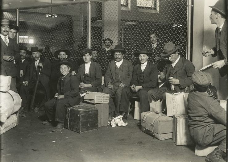 Italian immigrants with their luggage at Ellis Island in 1908